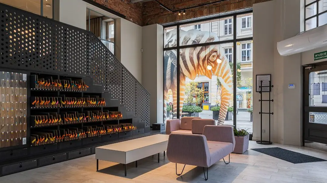 Brand showroom with a product display wall and lounge seating